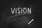 VISION written with chalk on blackboard icon logo design vector illustration