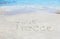 Visit greece written on sand