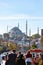 Visit Istanbul vertical background photo. Tourists and Suleymaniye Mosque