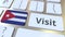 VISIT text and flag of Cuba on the buttons on the computer keyboard. Conceptual 3D animation