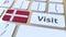 VISIT text and flag of Denmark on the buttons on the computer keyboard. Conceptual 3D animation