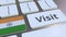 VISIT text and flag of India on the buttons on the computer keyboard. Conceptual 3D animation