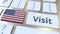 VISIT text and flag of the United States on the buttons on the computer keyboard. Conceptual 3D animation