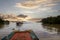 Visiting on boat tonle sap lake at sunset between mangroves trees