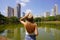 Visiting Goiania, Brazil. Back view of young woman in Parque Sulivan Silvestre also known as Parque Vaca Brava, a city park in