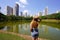 Visiting Goiania, Brazil. Rear view of beautiful girl in Parque Sulivan Silvestre also known as Parque Vaca Brava, a city park in