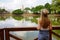 Visiting Goias State in Brazil. Back view of young traveler woman in the urban park Bosque dos buritis in Goiania, Goias, Brazil