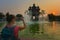 Visiting Laos - Young Woman admires beautiful Patuxai Monument in the city of Vientiane