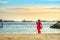 Visitor strolling and take picture at Siloso Beach during sunset, Sentosa Island, Singapore.