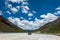 Visitors on 318 highway in Tibet under Blue sky white cloud