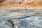 Visitors admiring the steaming volcanic pools at Hverir, Myvatn,