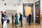Visitors and artists at the graphic art contemporary white gallery exhibition opening
