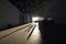 Visitors cast long shadows as they walk through the grounds of the Louvre Abu Dhabi