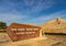 Visitors Center Sign With Rock Formations In The Background