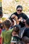 Visitors distributing snacks and goods to the Bajau Laut kids in their village