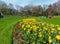 Visitors enjoy the beauty of Phoenix Park, in Dublin City, with its spring flowers and tulip beds.