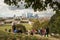 Visitors enjoy the view of the Canary Wharf skyscrapers from Greenwich park in London