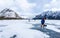 Visitors Enjoying Frozen Lake Minnewanka in Banff National Park