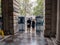 Visitors look out at rainy Strand from under Somerset House arcade