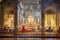 Visitors looking at the church\'s interior Chiesa di Ognissanti in Florence, Italy
