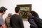 Visitors looking at Salvador Dali painting