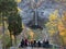 Visitors looking at waterfall, Taughannock Falls, tourist destination in Finger Lakes, New York. Travel, tourism in autumn.