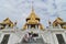 Visitors making their way up the steps to the main entrance of  Wat Traimit, the Temple of the Golden Buddha, Bangkok