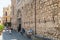 Visitors near wall of Duomo di Taormina