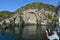 Visitors photographing the iconic Maori Rock Carving at lake Tau