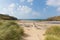 Visitors on Poldhu beach Cornwall England UK on the Lizard Peninsula between Mullion and Porthleven