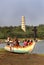 Visitors in small fisher mans harbor with manora fort tower .