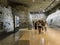 Visitors study a portion of the medieval Louvre as preserved in the modern museum, Paris, France