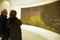 Visitors view Monet`s giant water lily oils