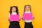 Visual communication concept. School friendship. Girls school uniform hold poster. School girls show poster. Social