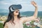 Visual reality concept. Woman getting experience using VR-headset glasses. Woman with glasses of virtual reality