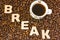 Visualization of the concept or action Coffee Break. Word break, which is lined with large, 3D letters, lies in scattered roasted