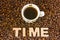 Visualization of the concept or action Time Coffee. Word time, which is lined with large, 3D letters, lies in scattered roasted be