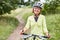 Vital senior woman is on a bike ride