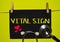VITAL SIGN on top of yellow background