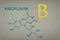 Vitamin B2. Riboflavin molecule on paper texture background. Skeletal formula of vitamin b2 riboflavin. Recessed text in