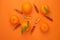 Vitamin C concept. Tangerines fruits, vitamin C in glass ampoules on a bright orange background.ampoules and Serum with Vitamin C.