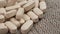 Vitamin C tablets close-up. Pile of beige pharmaceutical pills on a rough jute cloth