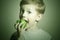 Vitamin.Child eating apple.Little Funny Boy with green apple. Health food. Fruits