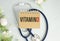 Vitamin D word on notebook,stethoscope