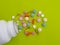 Vitamin pill treatment antibiotic aspirin  painkiller closeup a colored background pharmaceutical different