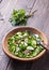 Vitamin salad of wild herbs with cucumber, radish and green onions