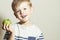 Vitamin.Smiling Child with apple.Little Boy with green apple.Health food. Fruits