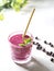 Vitamin smoothie from blackcurrant berries with yogurt and banana in a crystal glass. Healthy eating concept