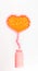 Vitamins of different types, yellow and peach color, in the form of a heart flying out of a plastic bottle. Isolated