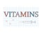 Vitamins word on checkered paper sheet